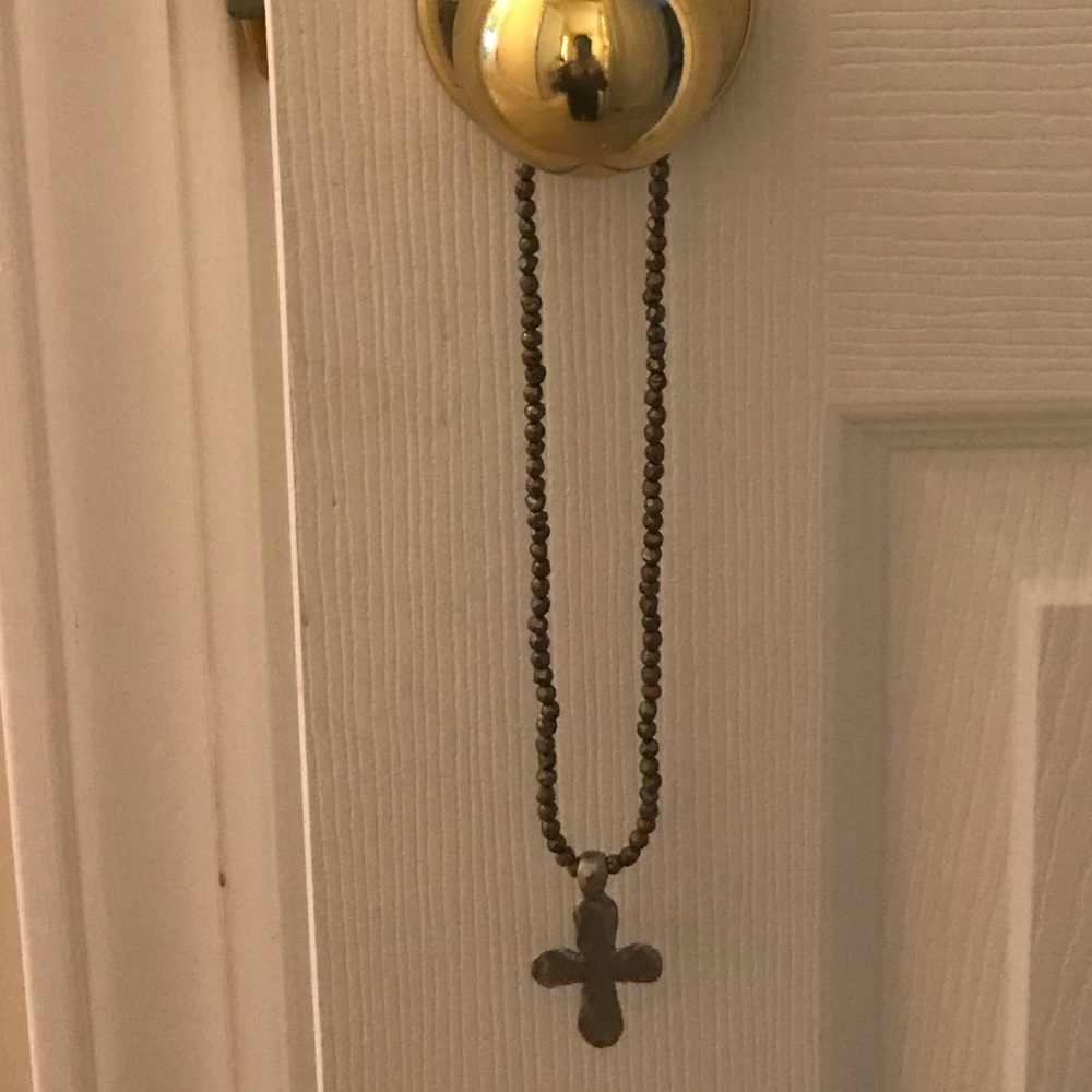 Grey stone stretch cross necklace.